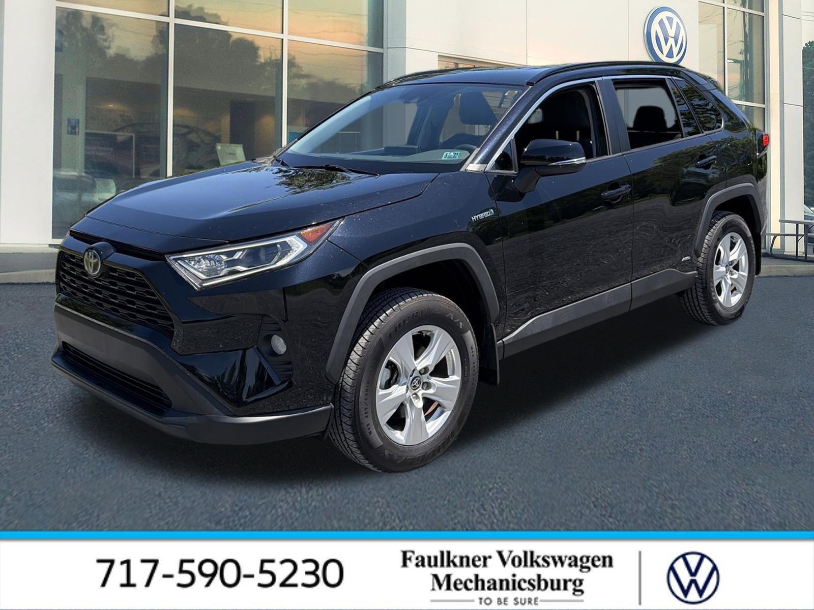 2021 Toyota RAV4 Hybrid XLE AWD (Natl) in Midnight Black Metallic — front three-quarter view