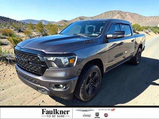 2023 RAM 1500 Big Horn 4x4 Crew Cab 5'7" Box in Granite Crystal Metallic Clearcoat — front three-quarter view