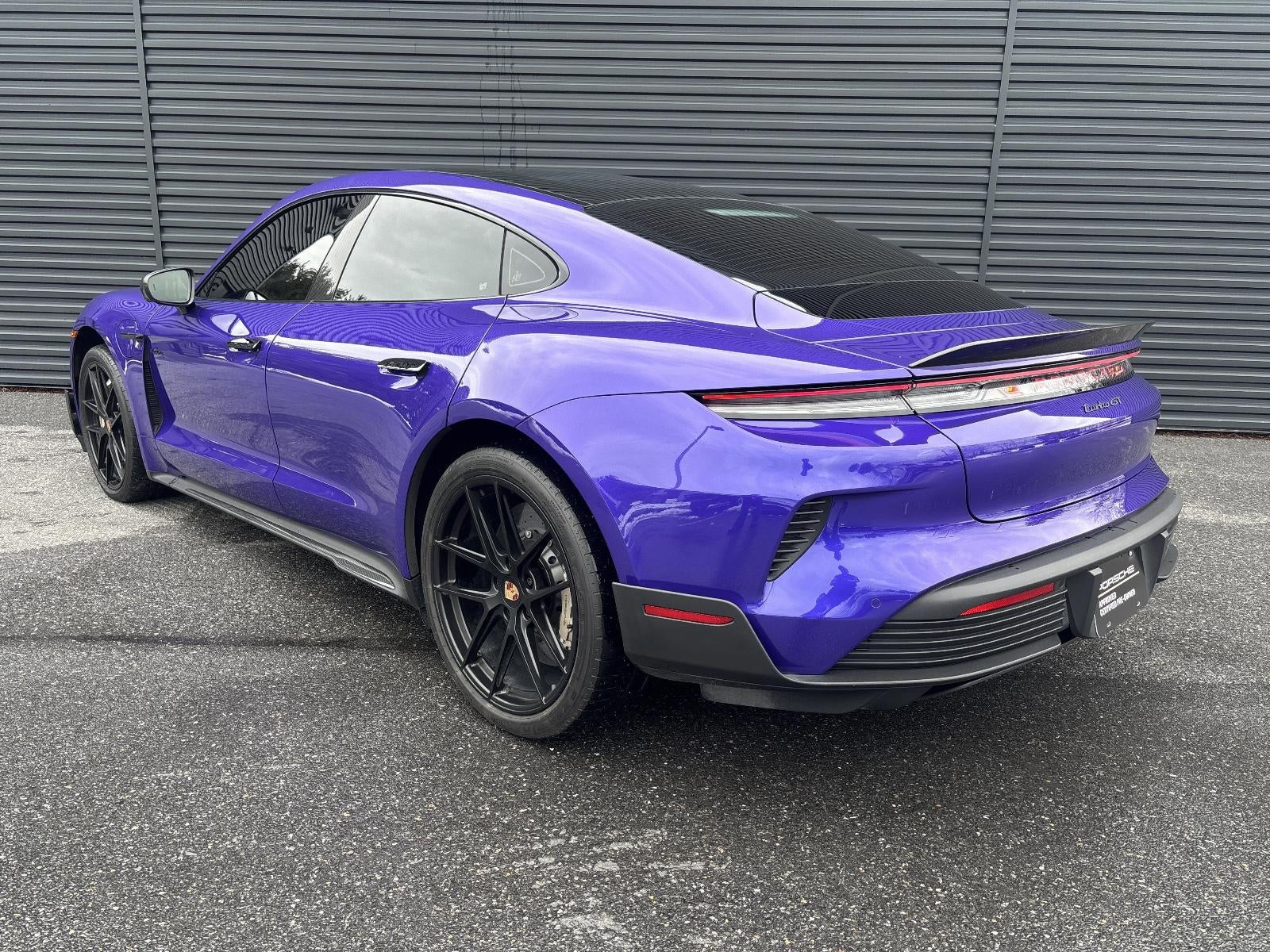 2025 Porsche Taycan — rear three-quarter view